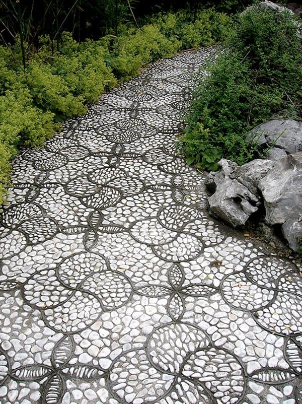 The white flowers are japanese stewartia. 13 Beautiful Garden Pebble Paths That Will Make You Green With Envy