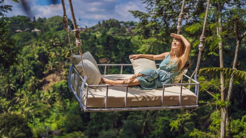 A tourist on a private jungle swing tour in Bali.