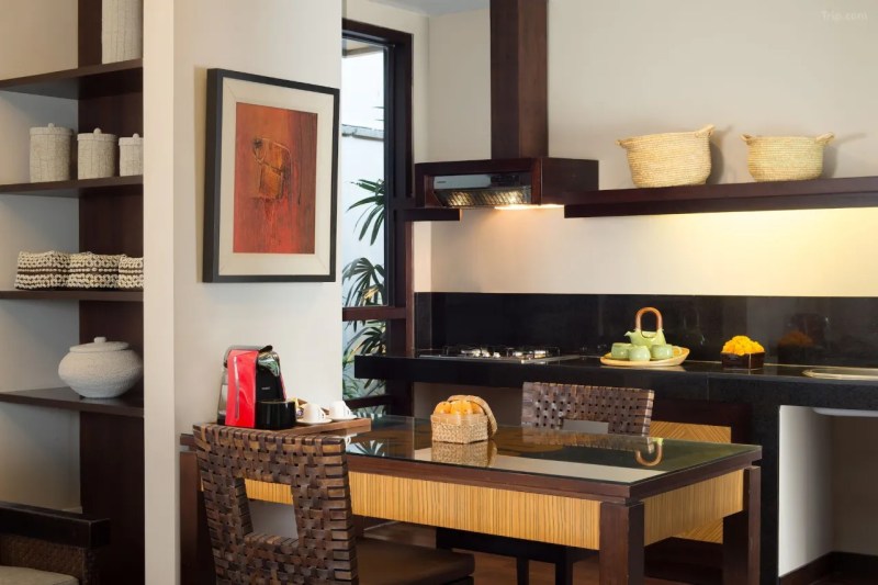 A modern and luxurious hotel kitchen, featuring high-end appliances and a sleek design in Alaya Dedaun Kuta hotel.