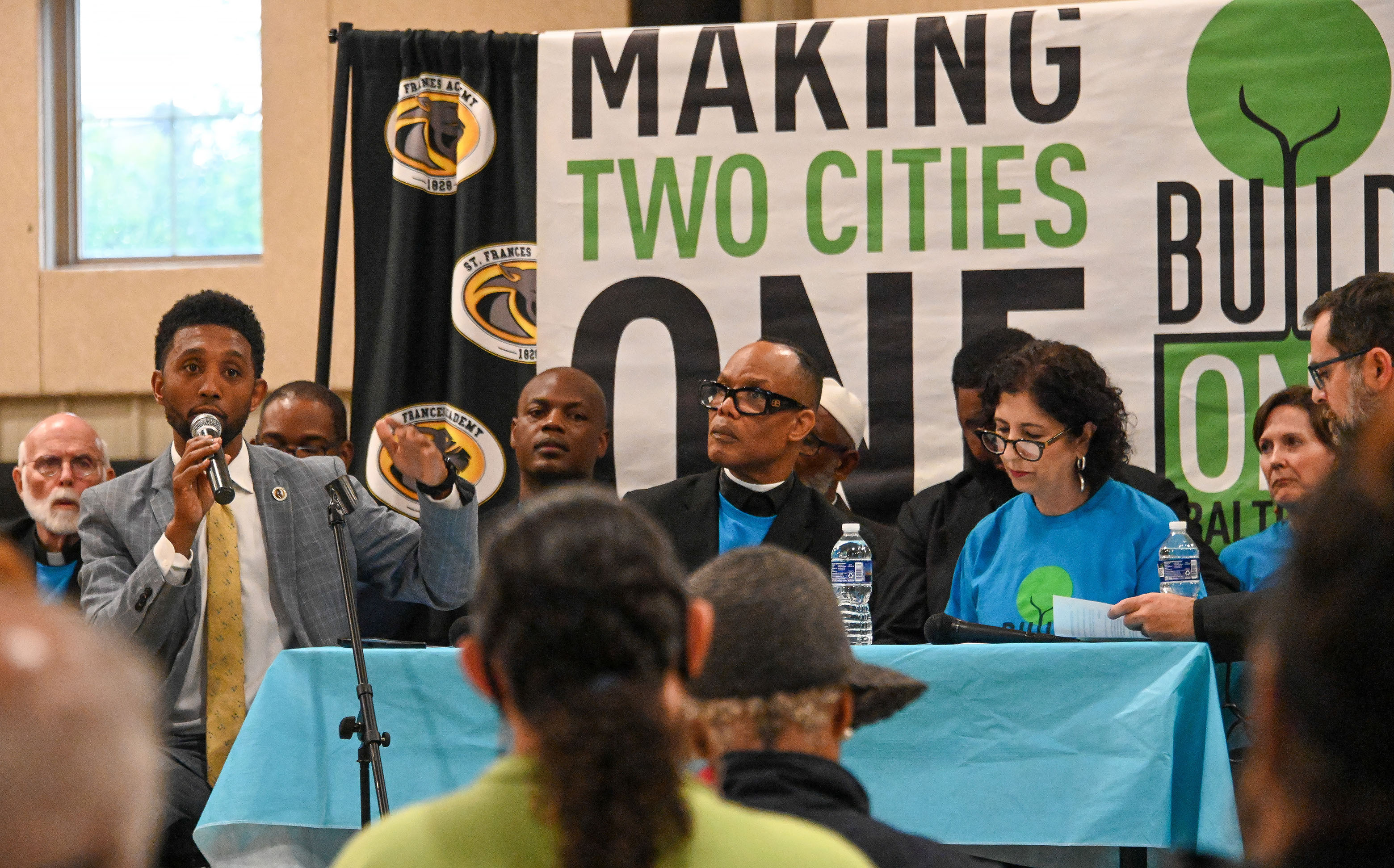 Baltimore Mayor Brandon Scott, left, participated in a mayoral race forum hosted by BUILD (Baltimoreans United In Leadership Development). (Kevin Richardson/Staff)