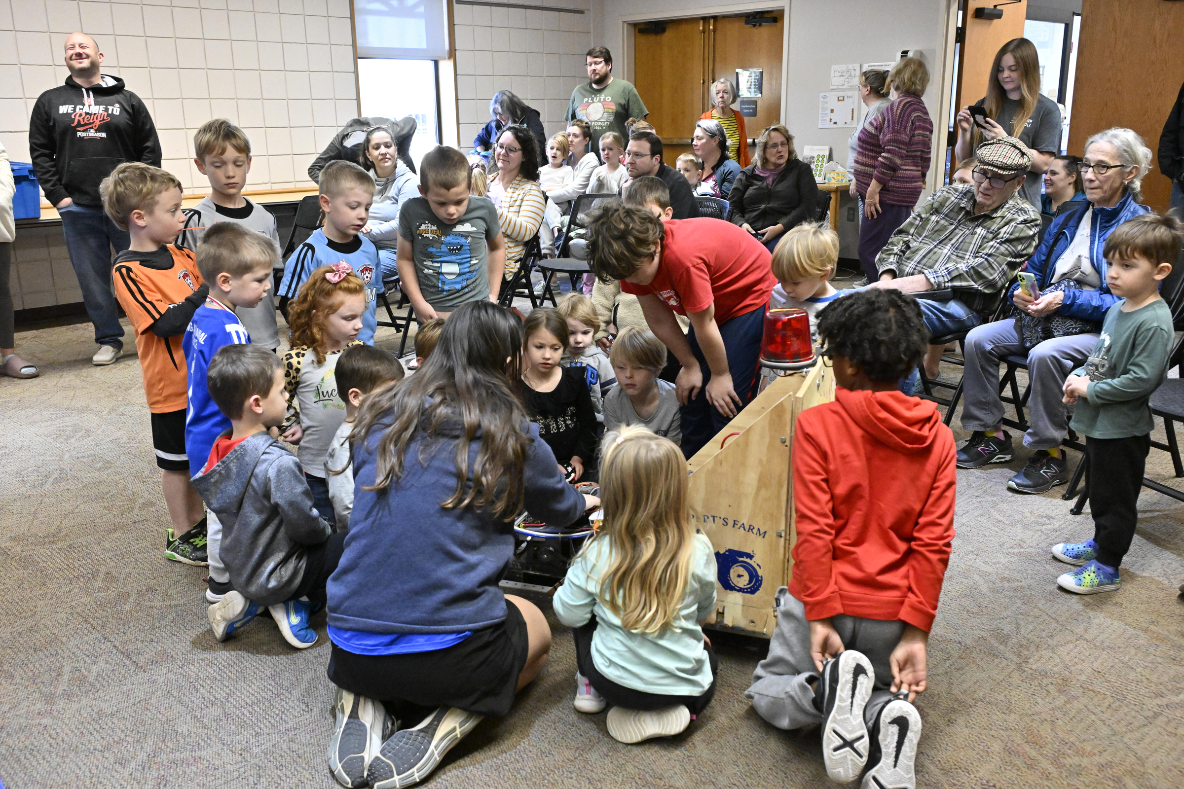Hannah Daly answers questions about the pumpkin smashing robot during the Robo Lions Pumpkin Smash at the Carroll County Public Library in Eldersburg. (Thomas Walker/Freelance)