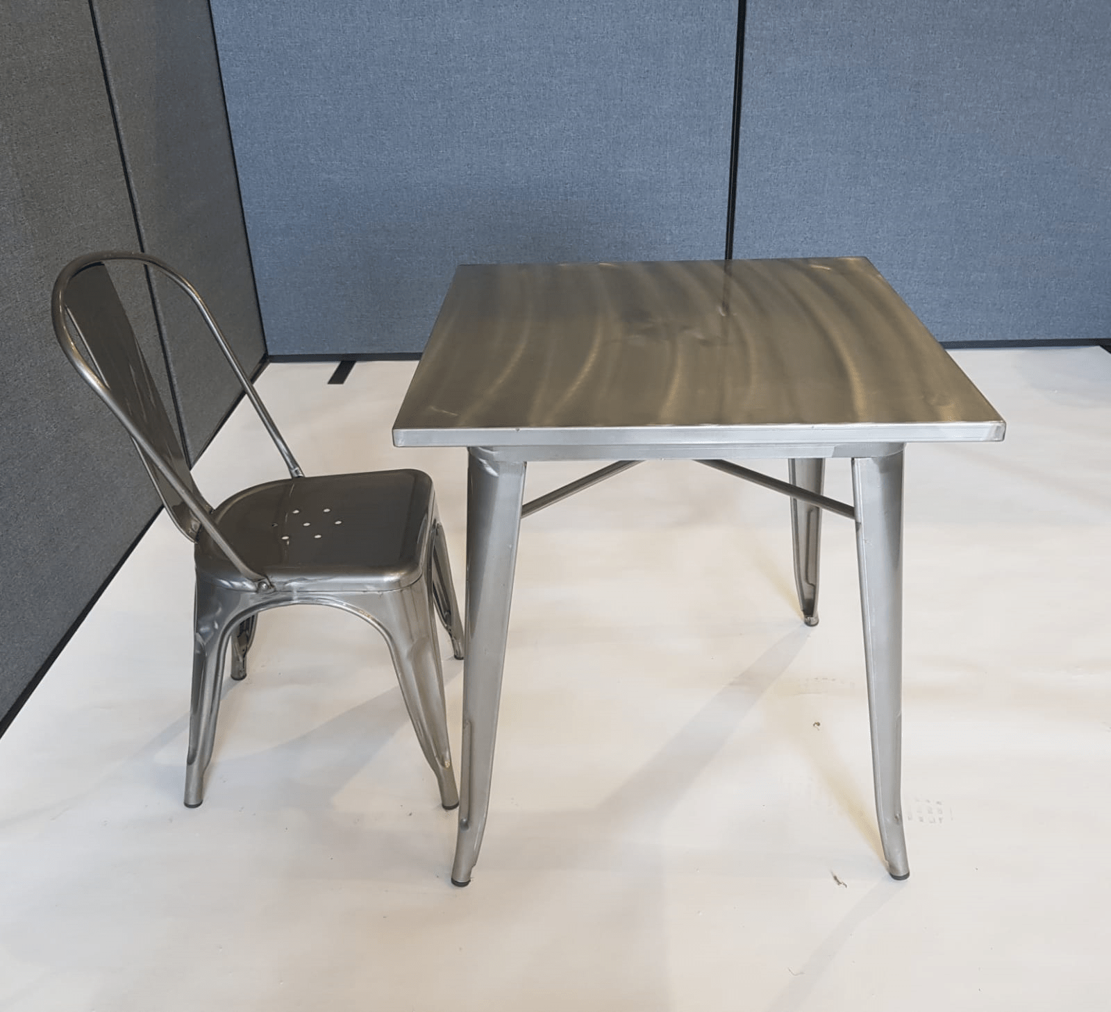 White wooden folding chair for hire. Square Tolix Table & 1 Silver Metal Tolix Chair - BE