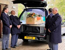 hearse with coffin at a funeral. Photo credit Ann Seymour