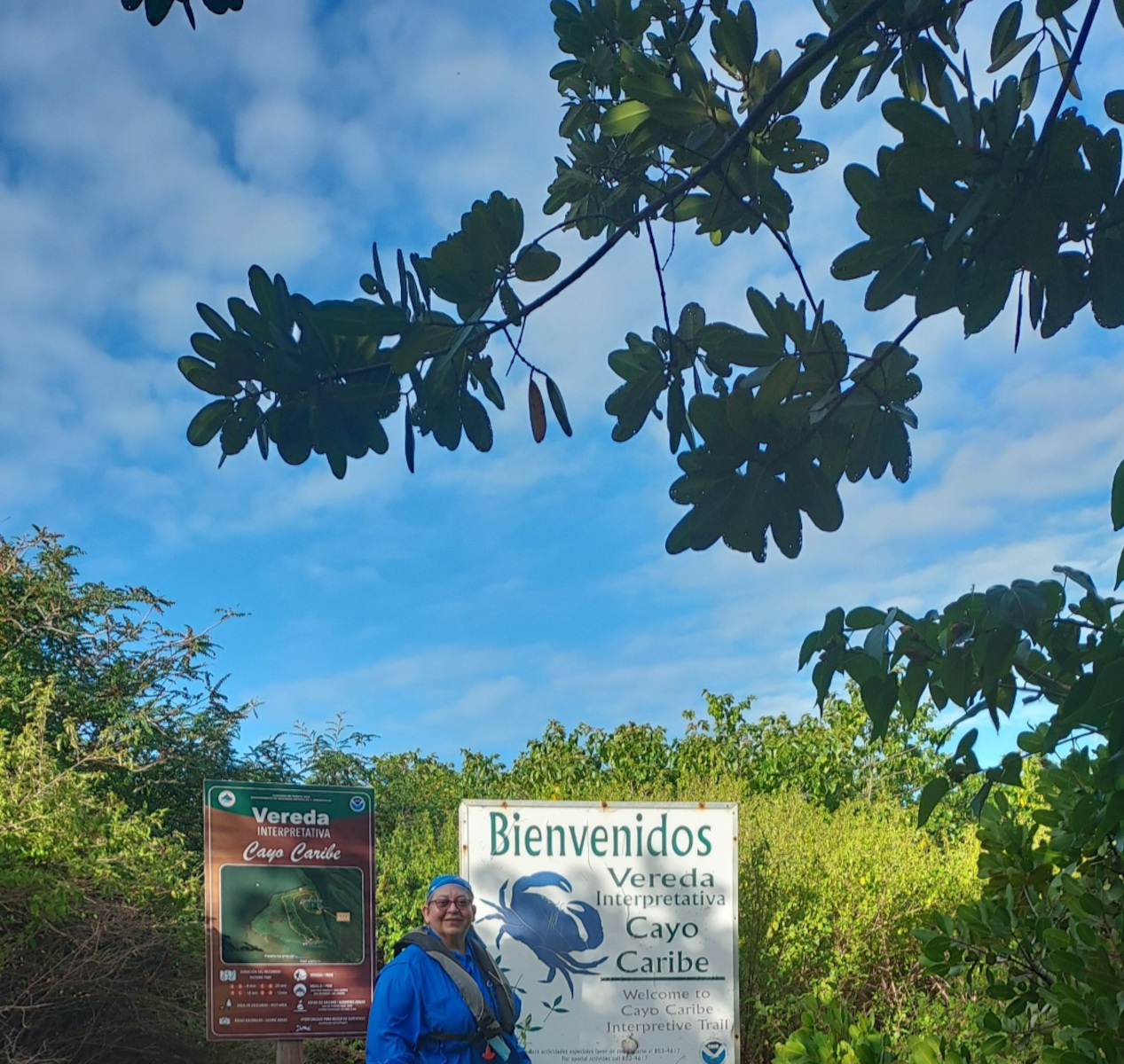 Person in front of a sign