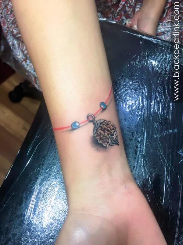 Shiva trishul tattoos, script and mantra tattoos like gayatri mantra tattoo, maha mrityunjaya mantra tattoo, om tattoos, rudraksha tattoos are some elements . God Mythology Black Pearl Ink
