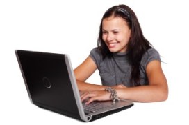 smiling woman typing