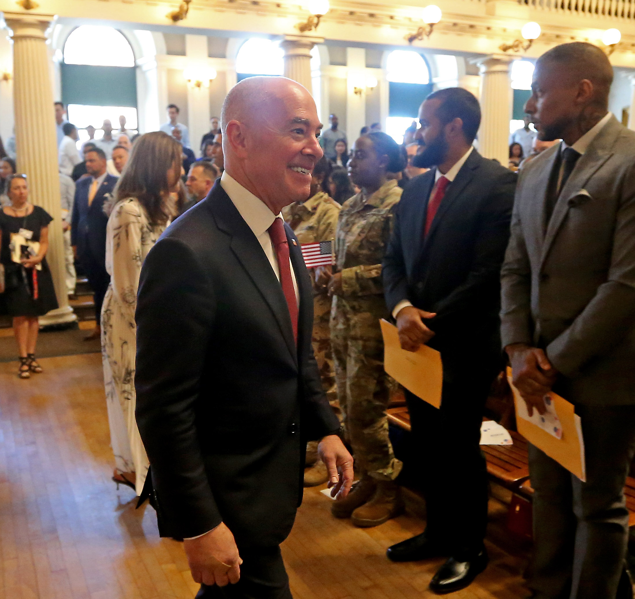 Dept. of Homeland Security Alejandro Mayorkas, also a naturalized citizen, walks thru the crowd.(Stuart Cahill/Boston Herald)