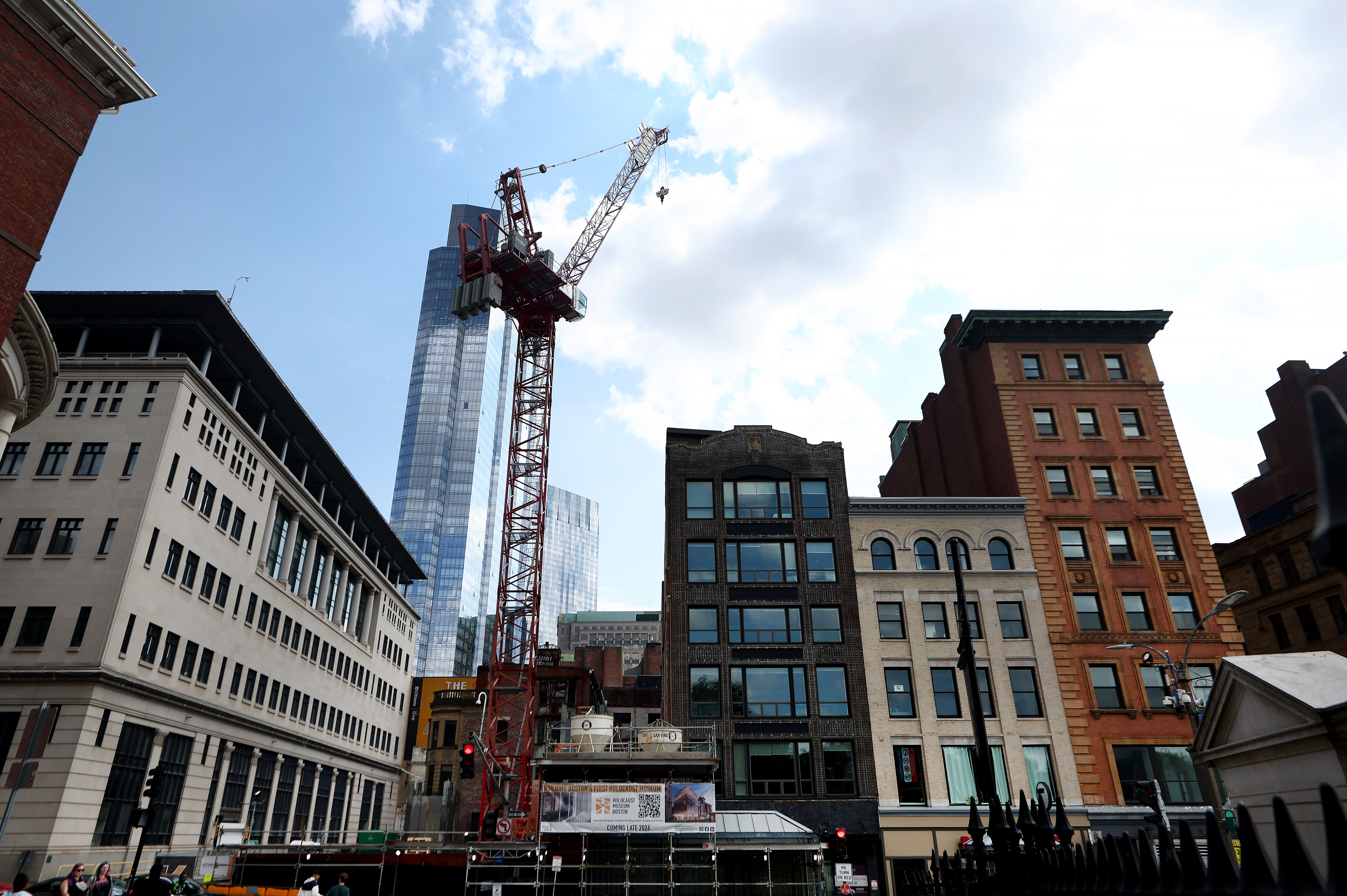 A high rise building goes up behind lower buildings lining Tremont Street. (Nancy Lane/Boston Herald)