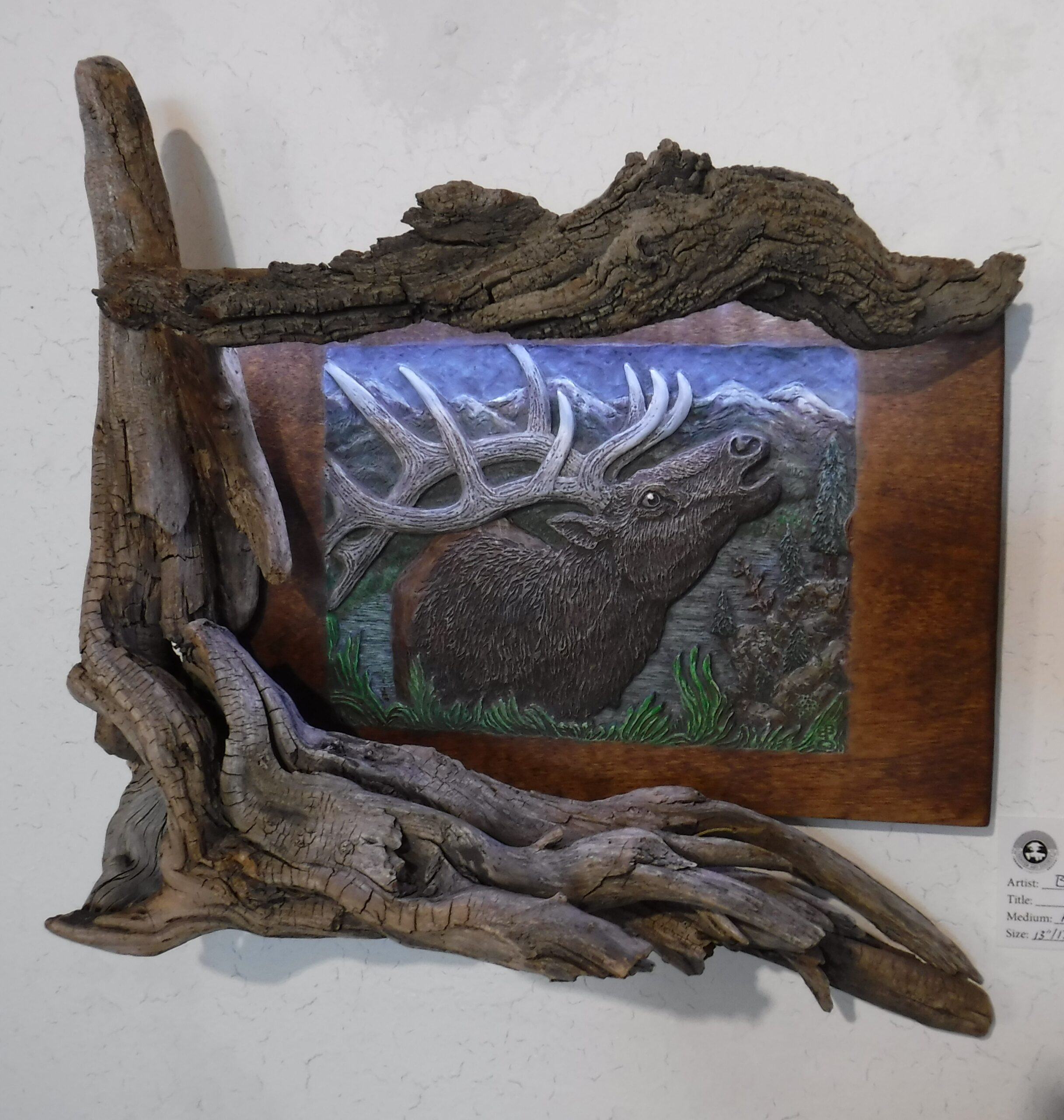 Elk carving in custom driftwood frame with light