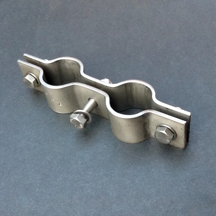 Saddle tee underside against pvc pipe. Double Pipe Clamp Stainless Steel 34mm Diameter Ports
