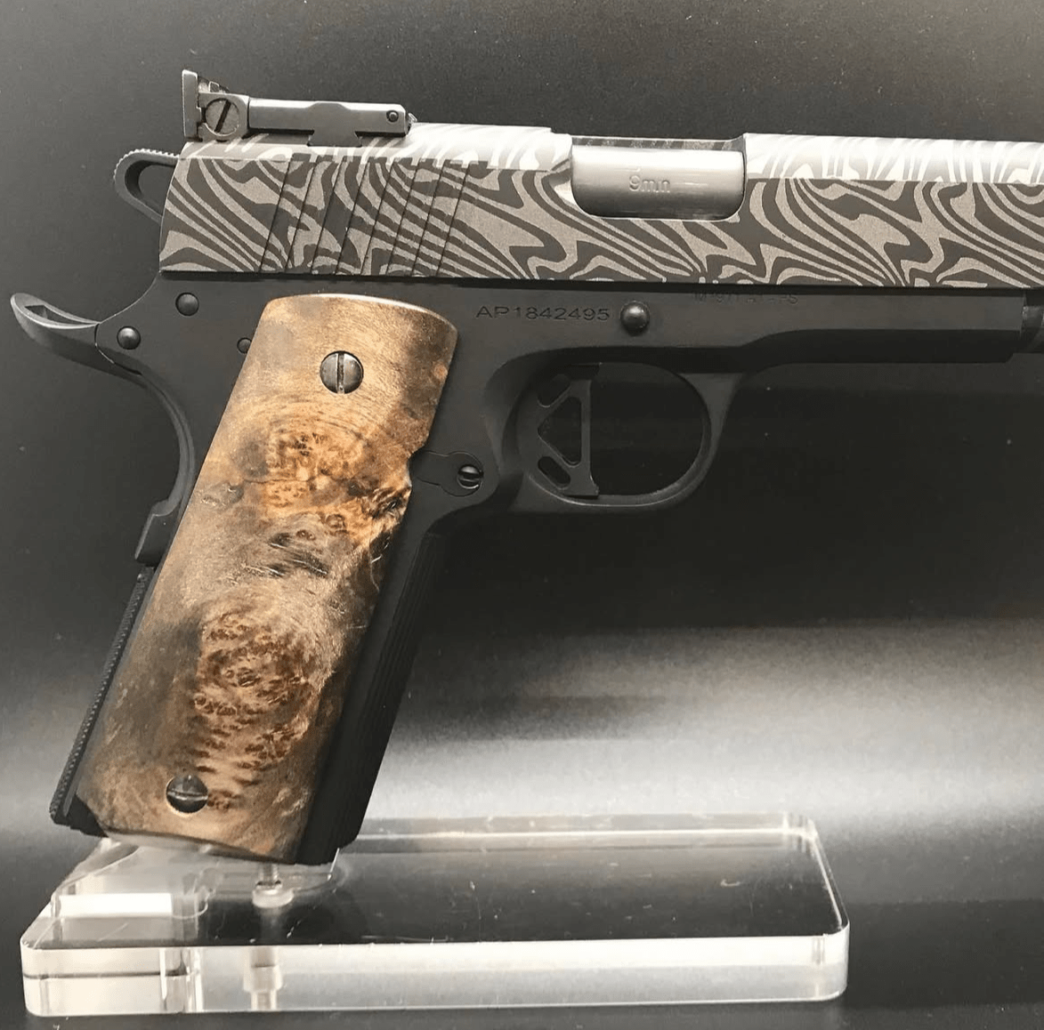 Black-dyed maple burl 1911 grips with a demascus Cerakote gun by C3 Customs