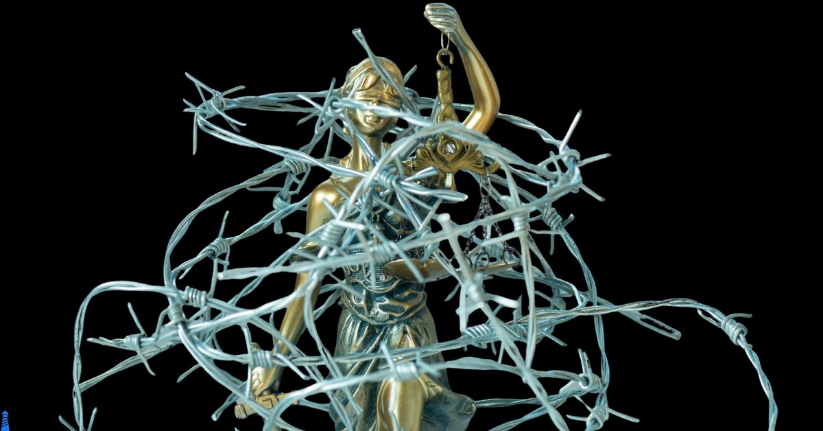 Wordsmith Wednesday - Quiet Exit. Lady Justice wrapped in barbed wire.