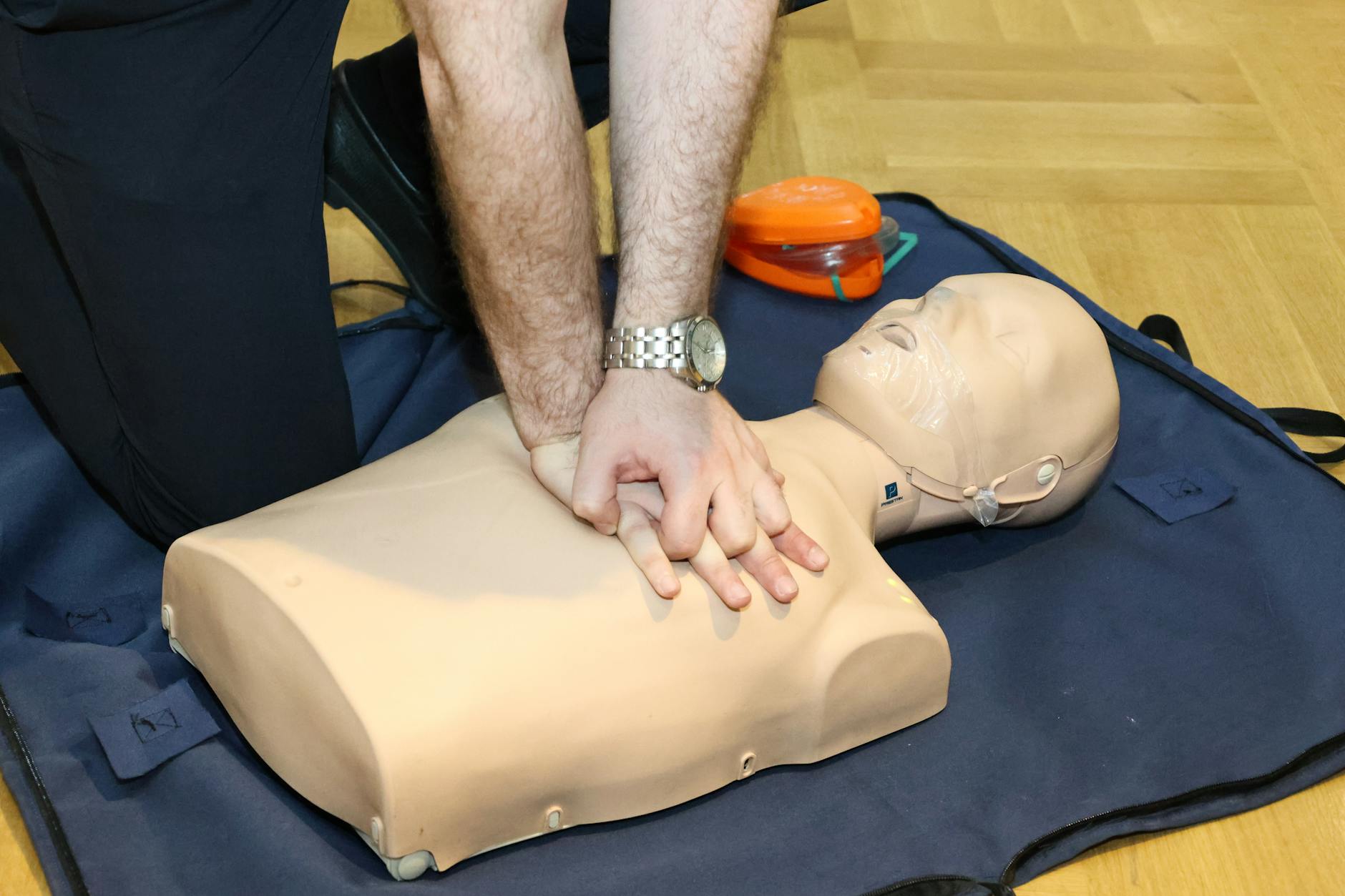 cpr training with mannequin dummy indoors