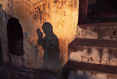 Tibetan monk prostrating at a prayer festival in Bodh Gaya, India, 2001