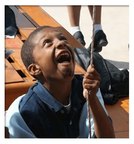 Birthday Boy Raising the Flag at Pirate Adventures