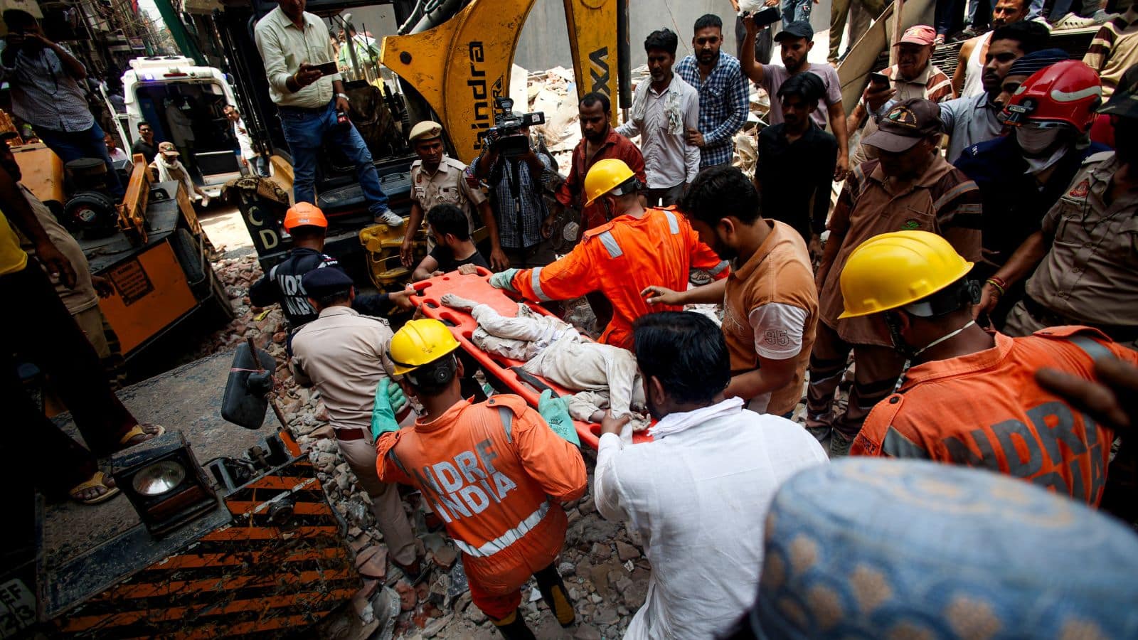 Five-Story Building Collapse in New Delhi Rescuers Rush to Help