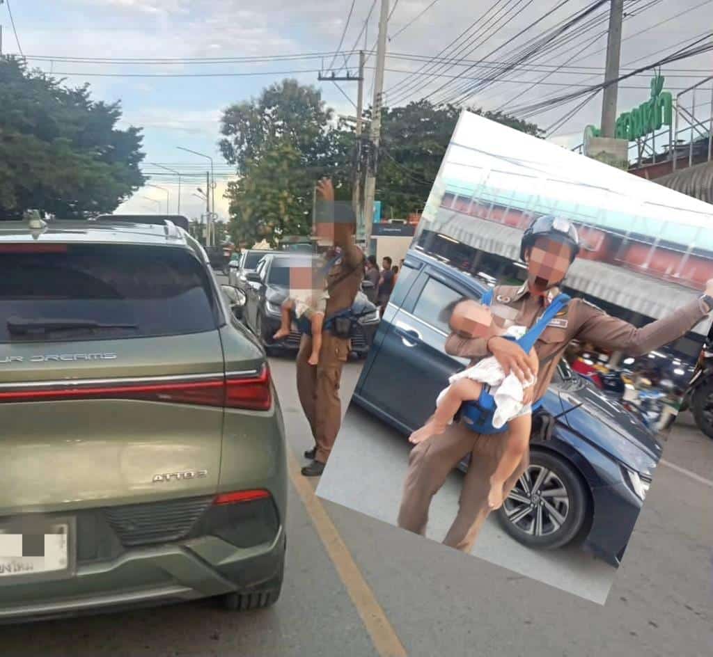 Chiang Mai Traffic Guard Directs Cars While Carrying His Baby