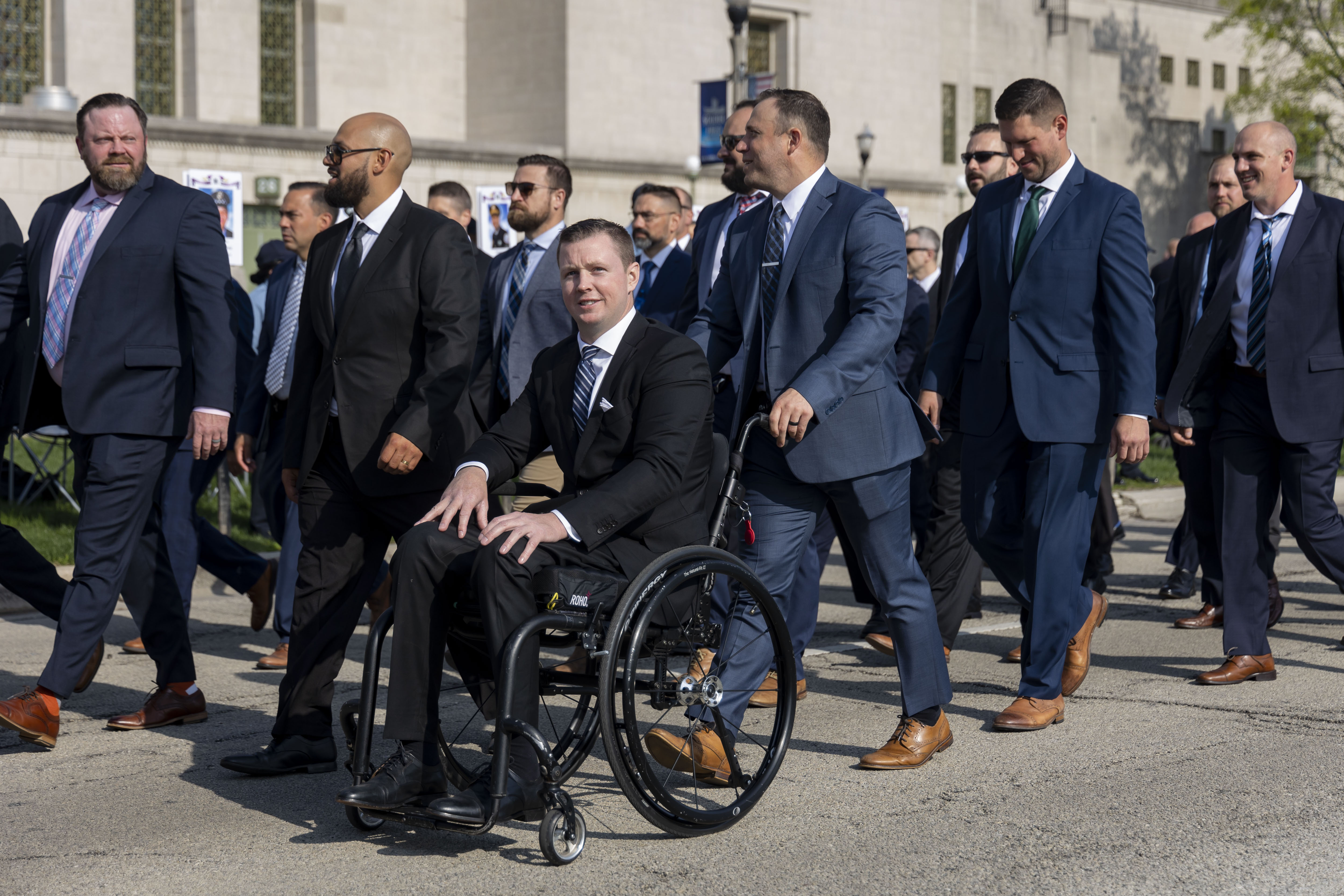 Chicago police Officer Danny Golden is pushed during the St. Jude Police Memorial March on May 7, 2023, at Gold Star Families Memorial and Park on the Museum Campus. (Brian Cassella/Chicago Tribune)