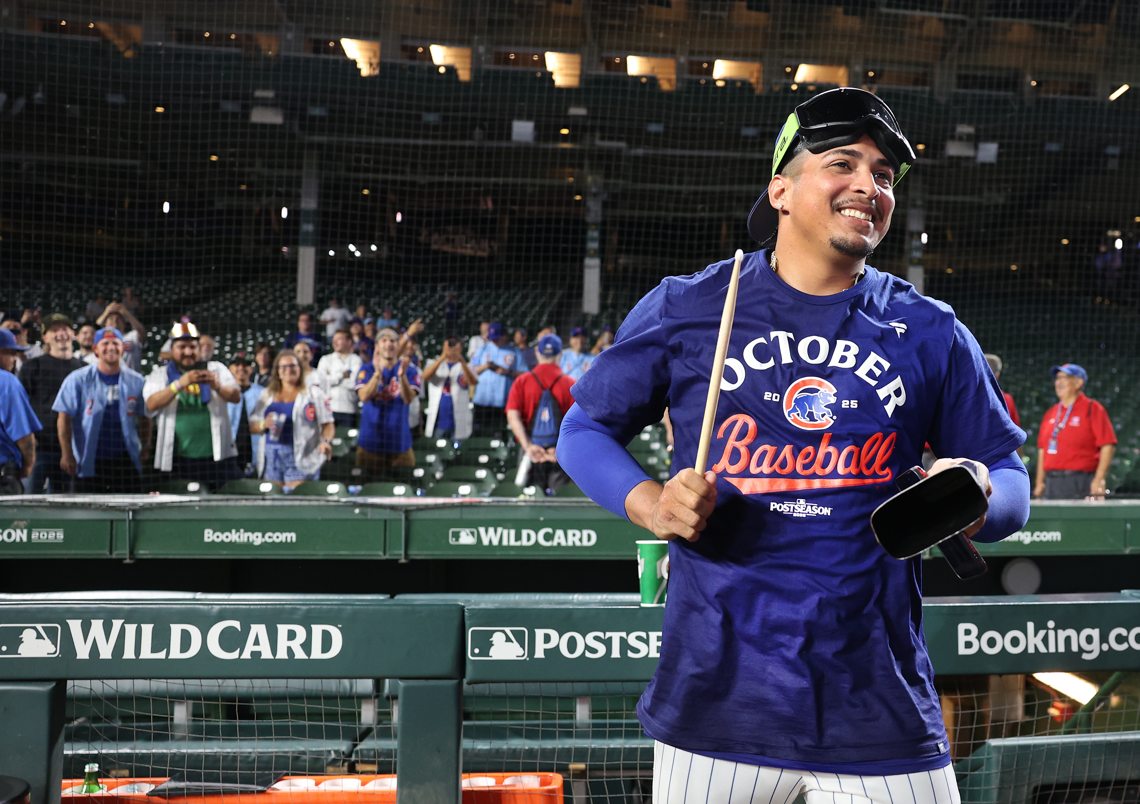Cubs relief pitcher Daniel Palencia beats a cowbell after the Game 3 win at Wrigley Field on Oct. 2, 2025. (Chris Sweda/Chicago Tribune)