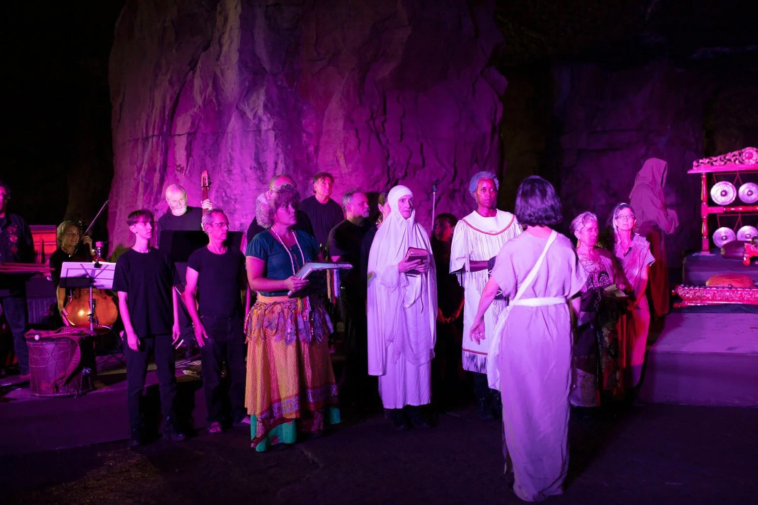 Actors performing in a cave