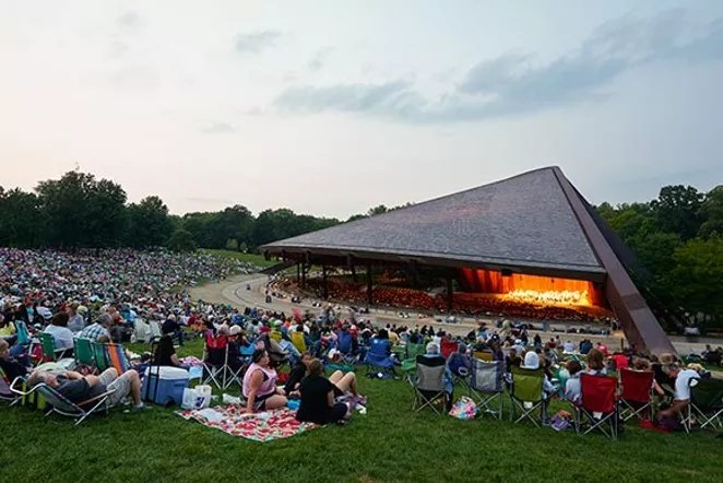 People at an outdoor concert venue.