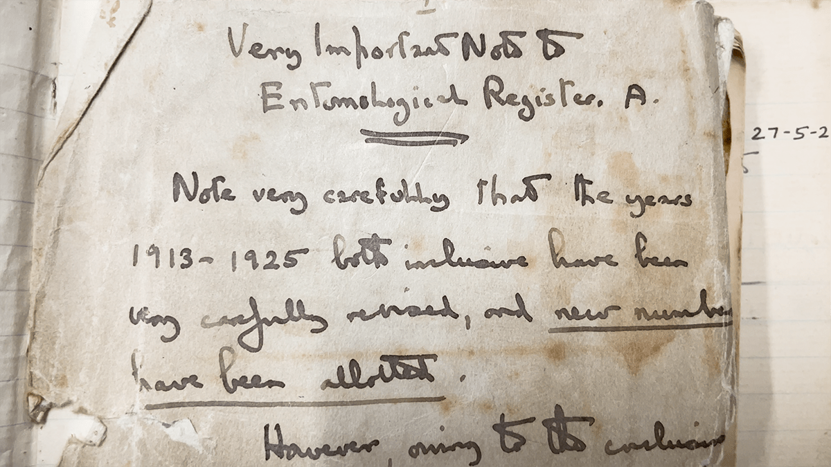 page of an old notebook with hand written text in ink