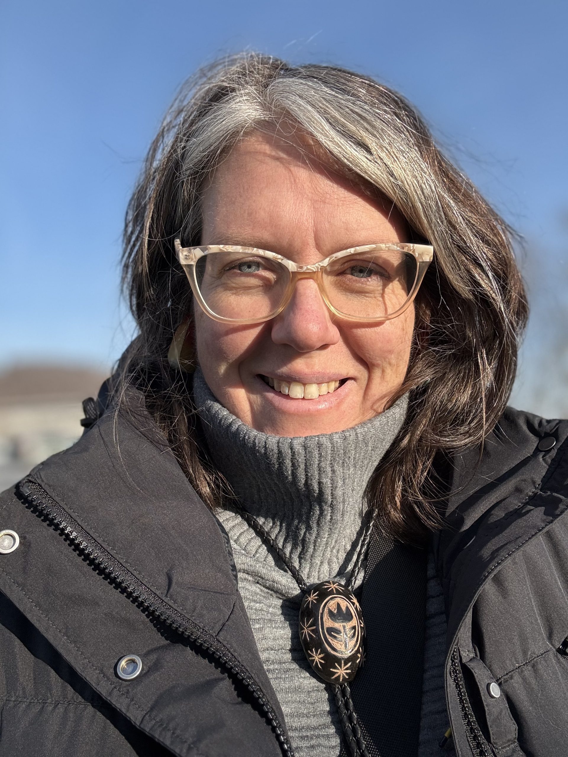 Jen Allen standing outside on a clear day