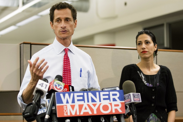 FILE - In this July 23, 2013 file photo, then-New York mayoral candidate Anthony Weiner speaks during a news conference alongside his wife Huma Abedin in New York. The FBI informed Congress on Friday, Oct. 28, 2016, it is investigating whether there is classified information in new emails that have emerged in its probe of Hillary Clinton's private server. A U.S. official told The Associated Press the newly discovered emails emerged through the FBI’s separate sexting probe of former congressman Anthony Weiner, the estranged husband of close Clinton confidant Huma Abedin.  (AP Photo/John Minchillo, File)