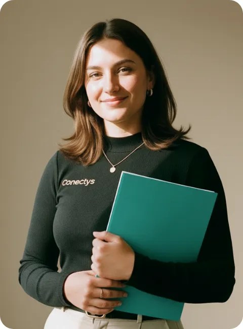 Young adult woman smiling and holding a notepad