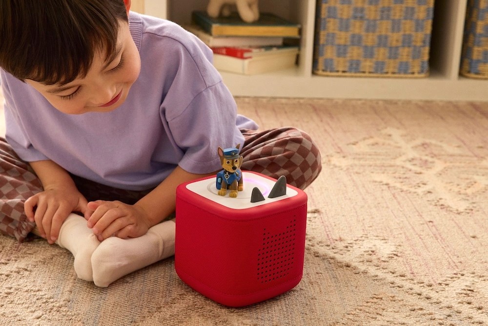 Child playing with a Tonies audio player