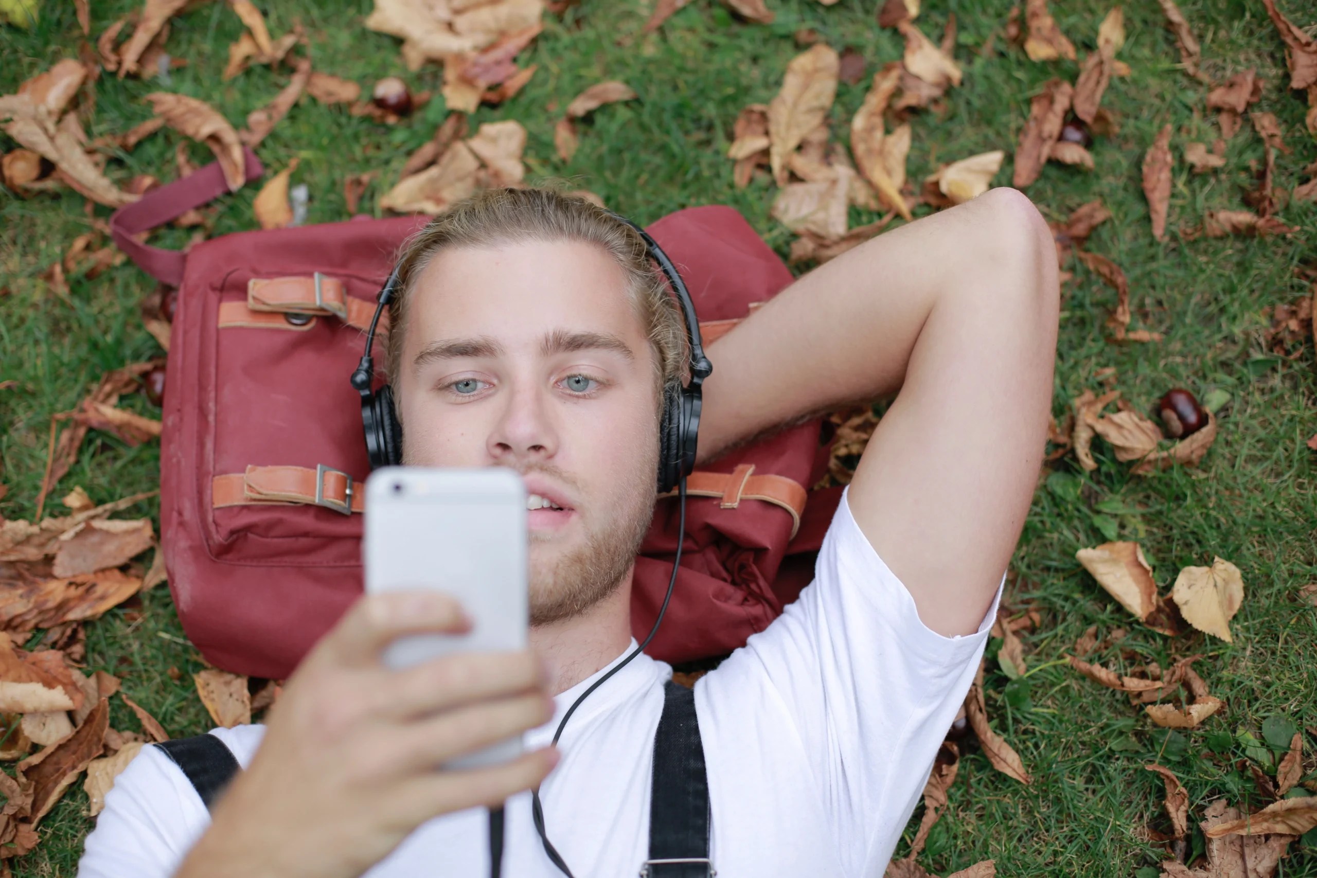 Person listening to Spotify on a smartphone outdoors