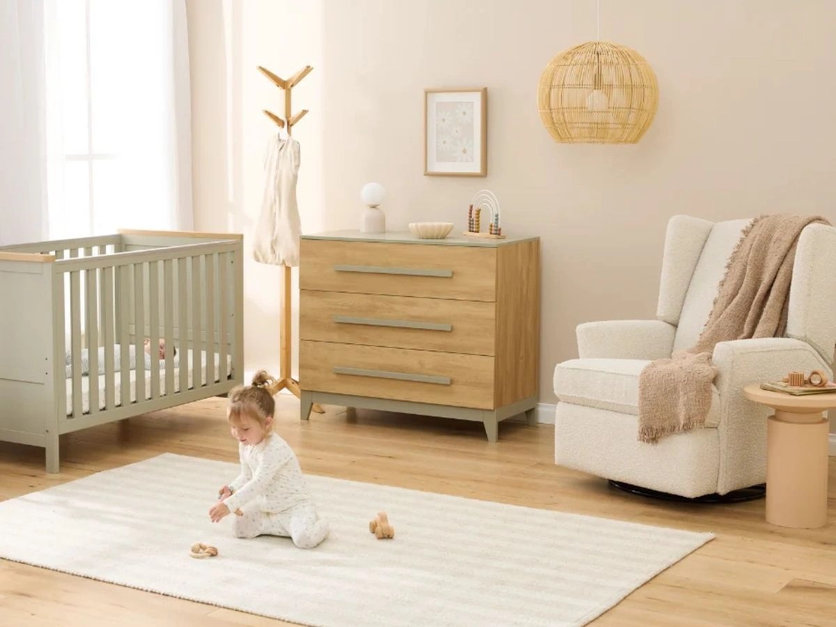 iL Tutto nursery furniture in a modern baby room with nursing chair, cot and chest of drawers