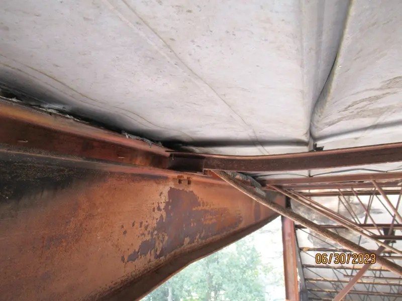 Deformed steel joists and beam after fire.