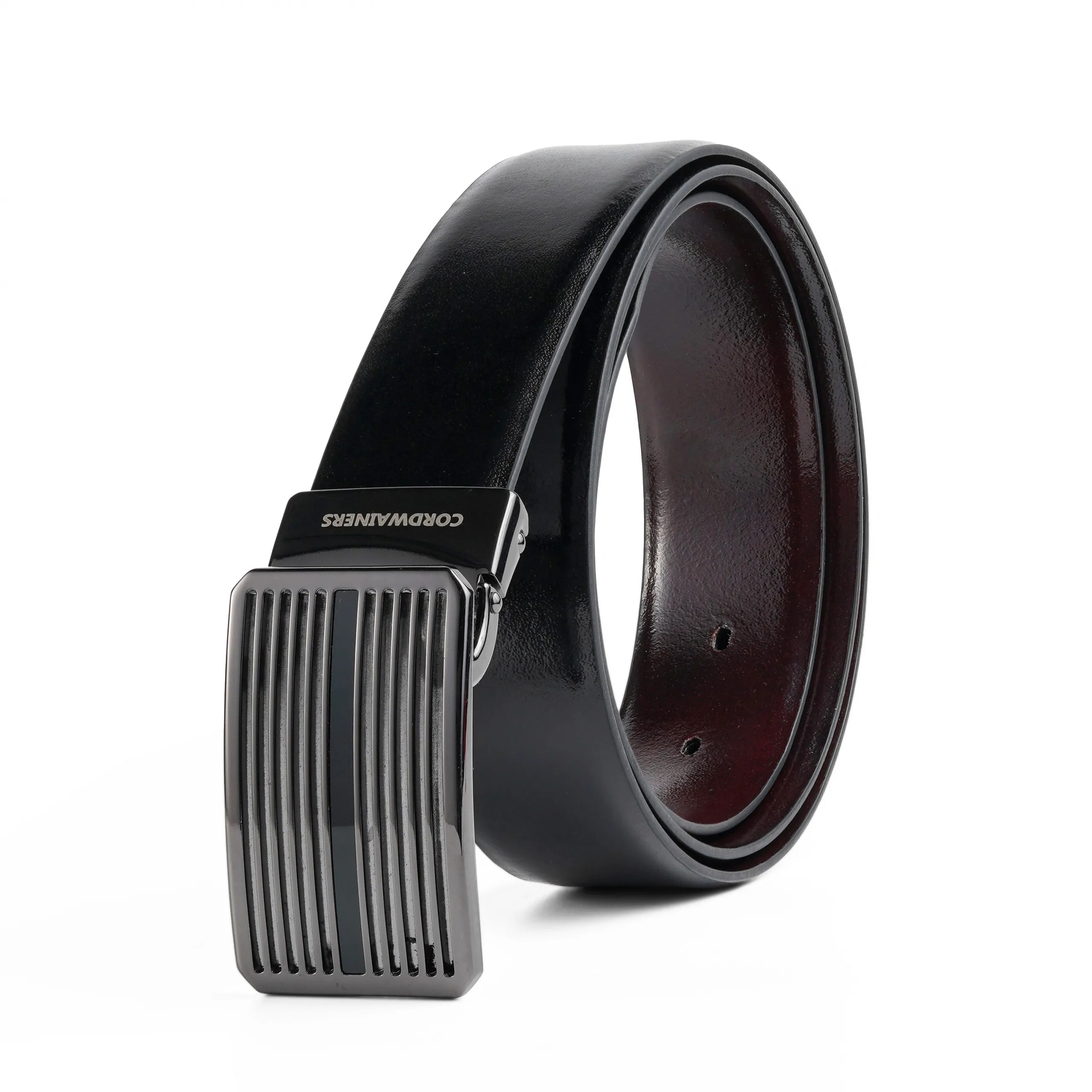 Premium reversible leather belt with a sleek silver buckle. Dual-sided in black and charry for versatile, elegant styling.