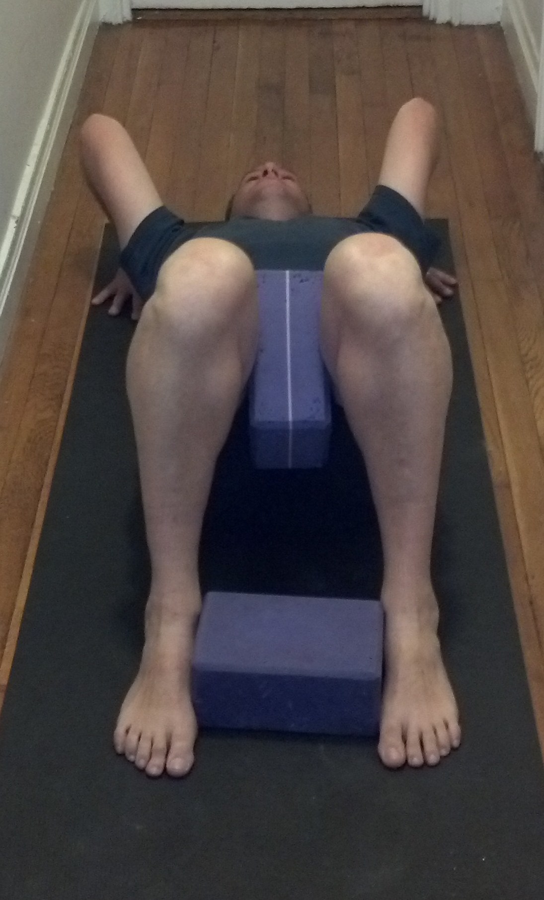 Doing urdhva dhanurasana, wheel pose, with blocks