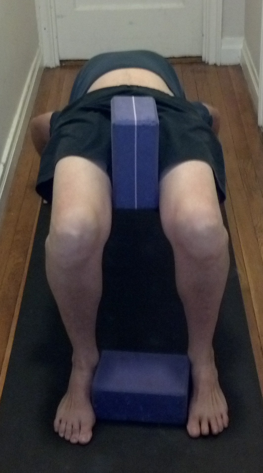 Doing urdhva dhanurasana, wheel pose, with blocks