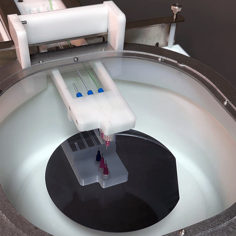 A photograph of the AccuScan™ programmable dispense arm for Apogee® Spin Coaters.