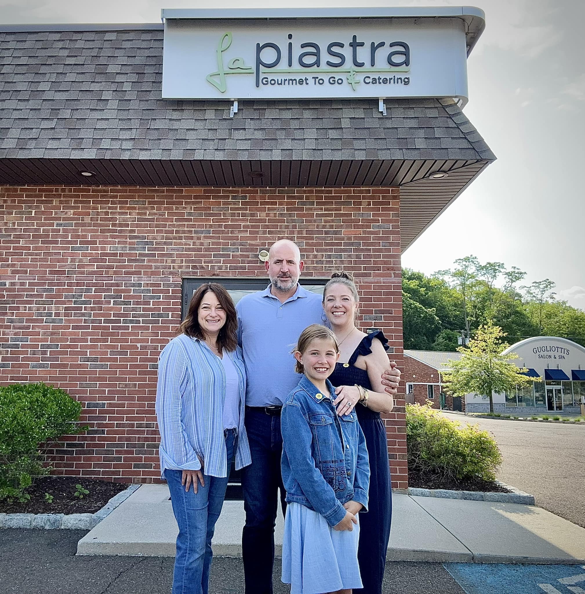From left to right, Lauren Siegel, former owner of LaPiastra, Kyle Hardy, who bought the business, his wife, Kerri Hardy and the couple's daughter, Charlotte, 9. The Hardy family, owner of The Charles restaurant will open a prepared foods and French bakery business, Bake Market.