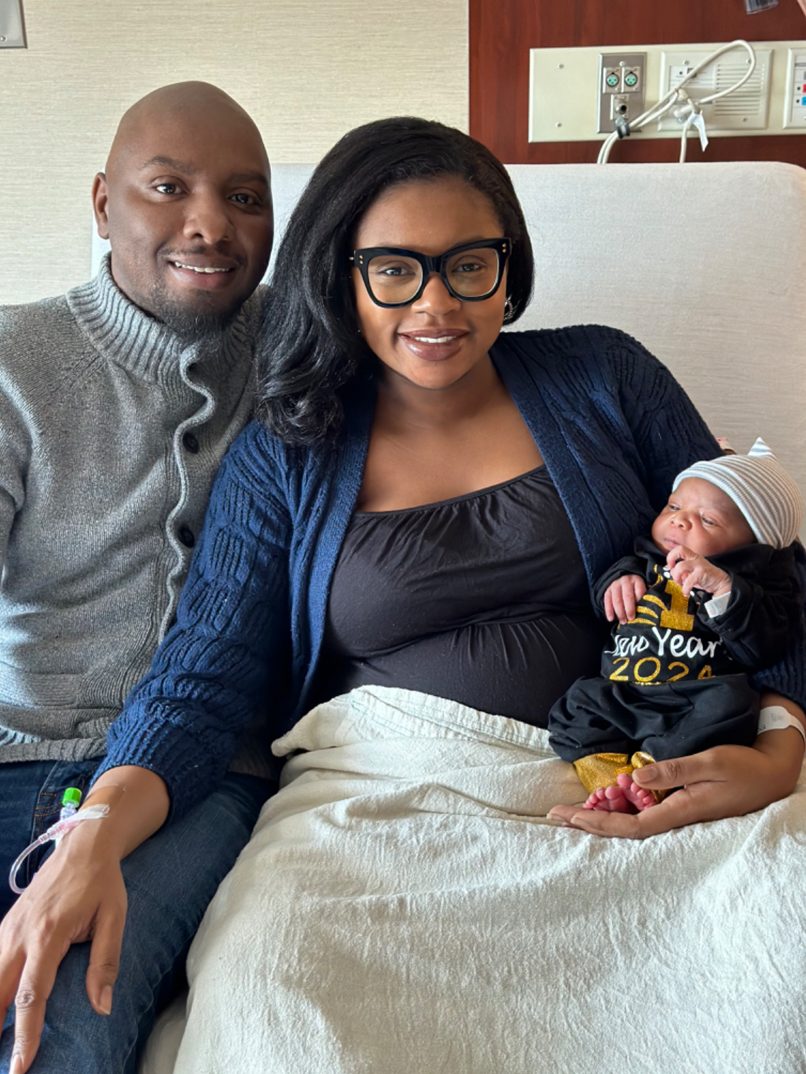Murielle and Sterling Gatewood of Enfield hold their new baby boy. Baby Gatewood was the first baby of 2024 born at Hartford Hospital. (Credit: Hartford Hospital)