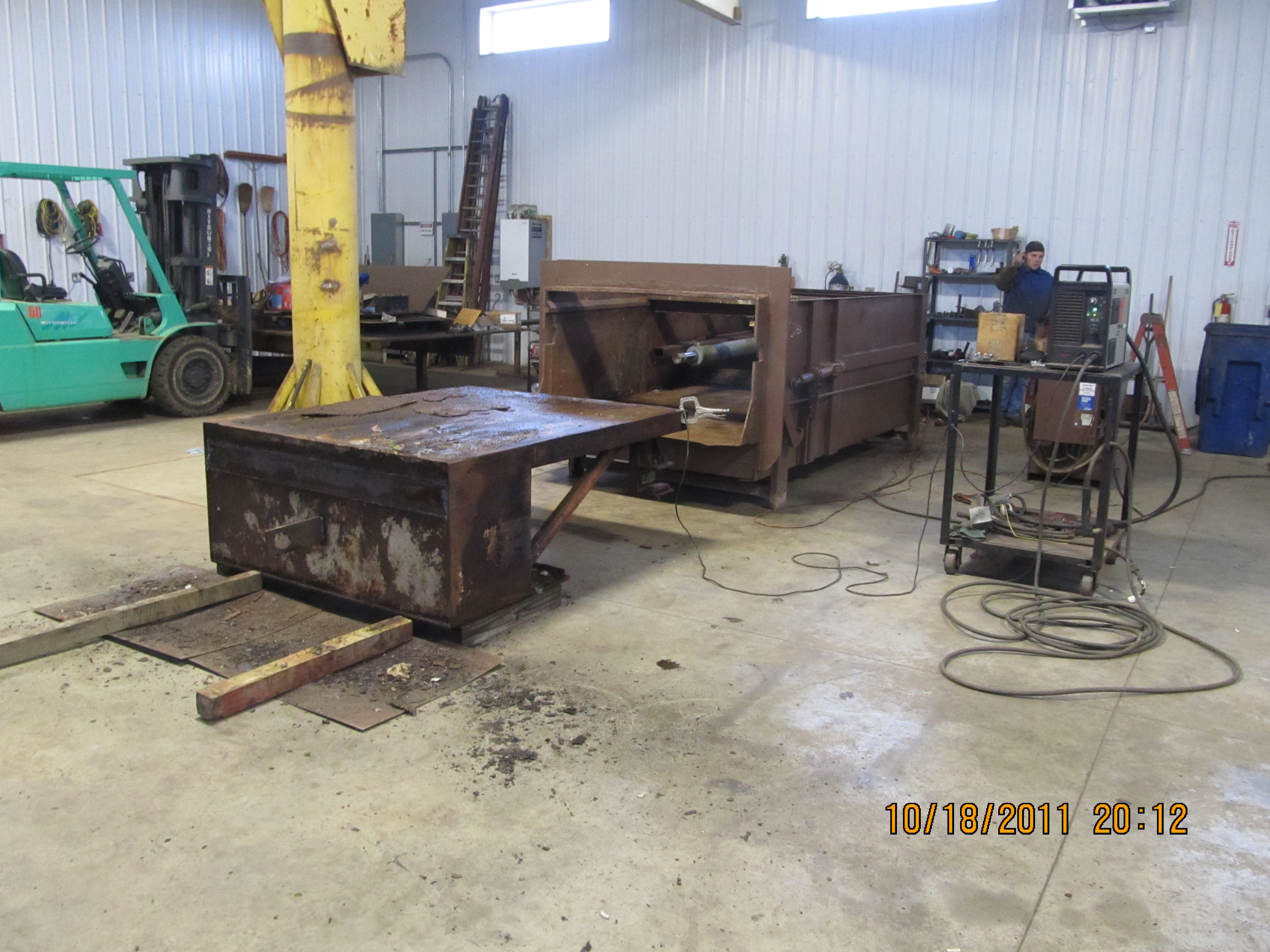 Disassembled compactor