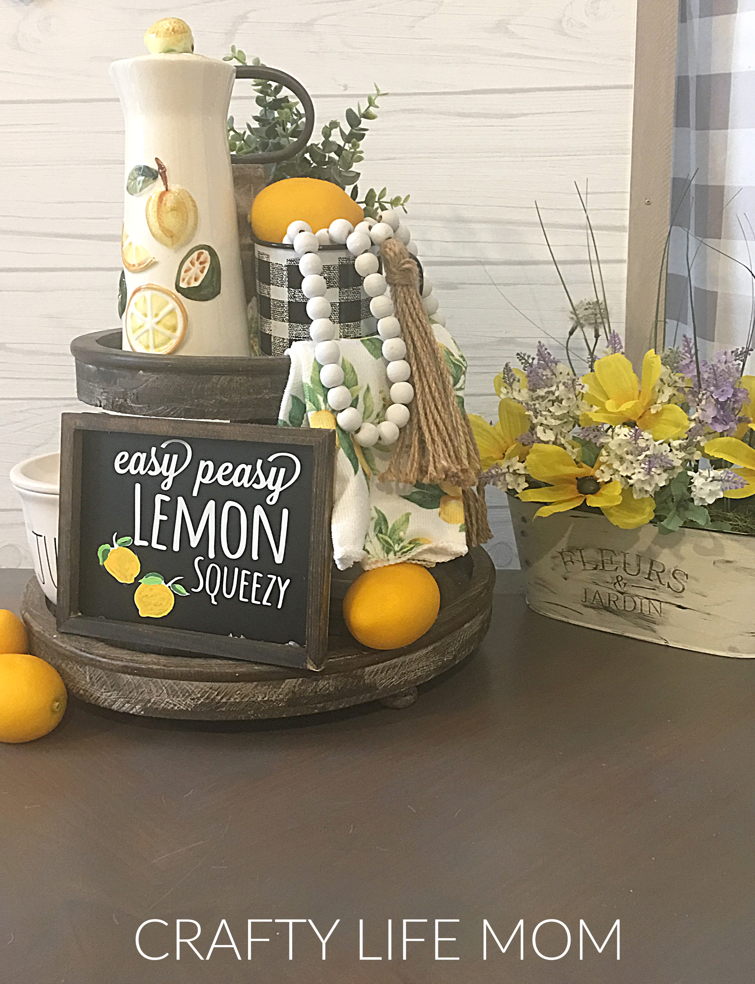Create this Easy Peasy Lemon Squeezy sign using Dollar Tree items with this free SVG cut file design with your Cricut or Silhouette machine. You can download Free Lemon SVG cut file from the Resource Library and create your own Lemon Decor sign. 