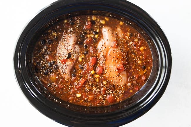 whole chicken breasts in slow cooker with corn, beans, tomatoes and quinoa