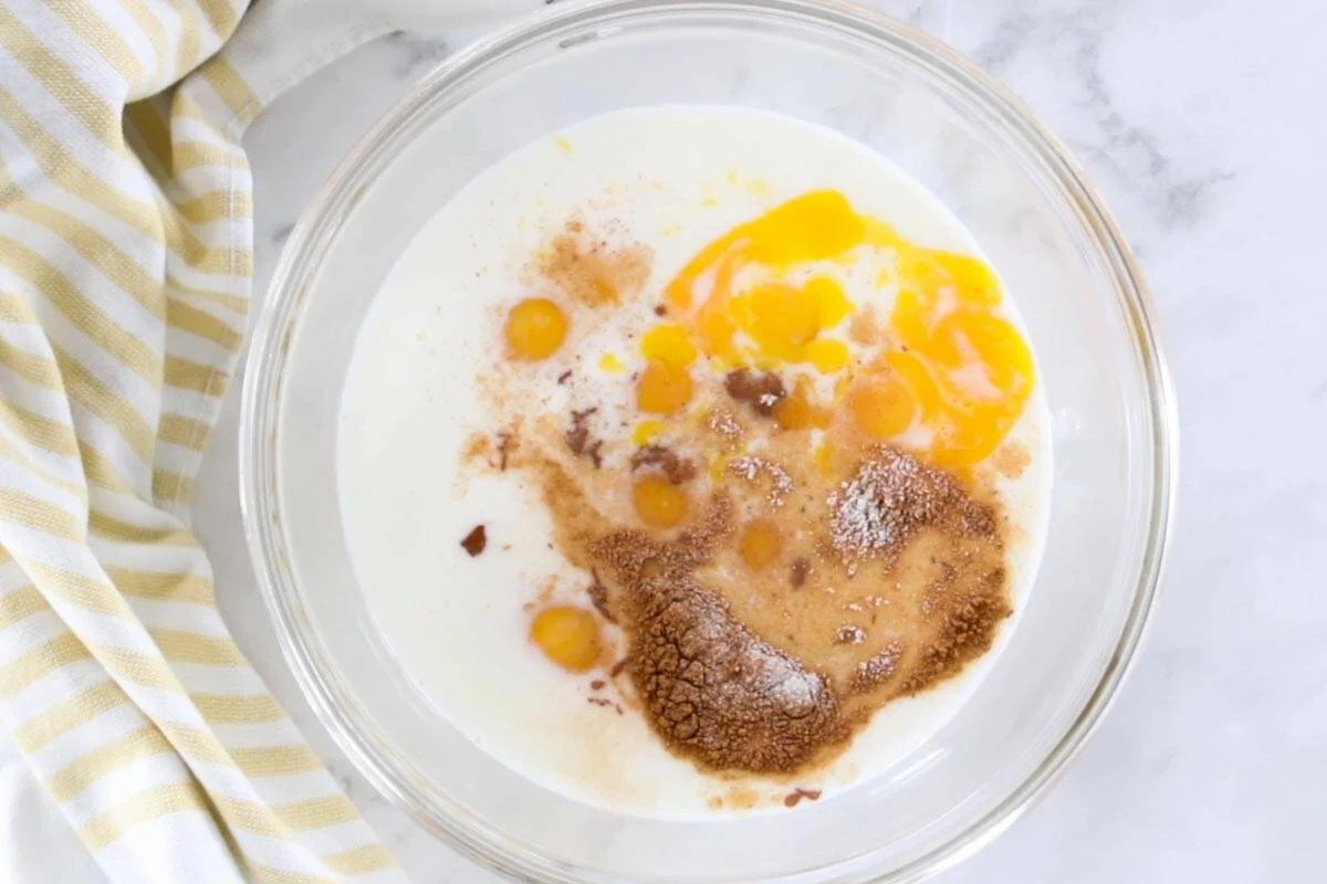 egg, milk and cinnamon mixture in a mixing bowl
