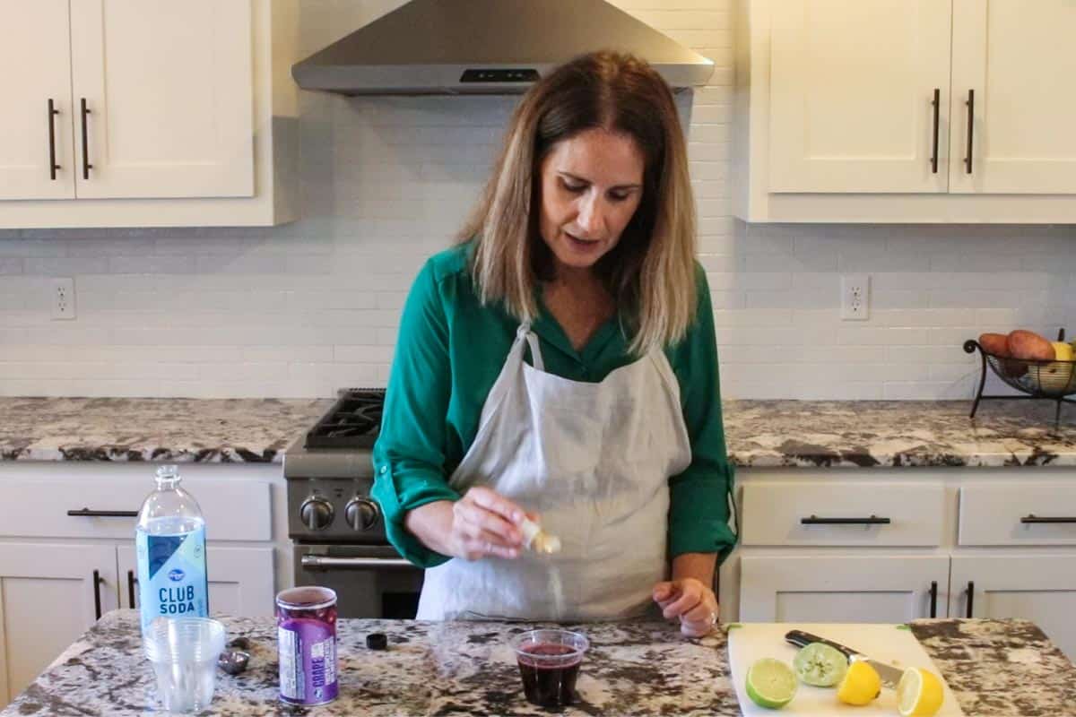 jodi of create kids club in the kitchen making fruity mocktails