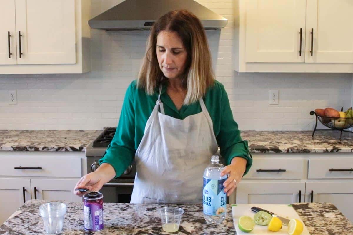 jodi of create kids club in the kitchen making fruit mocktails