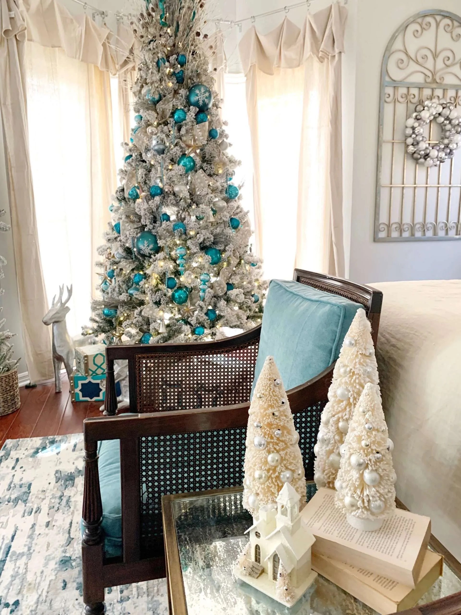Flocked trees add a cozy feel.