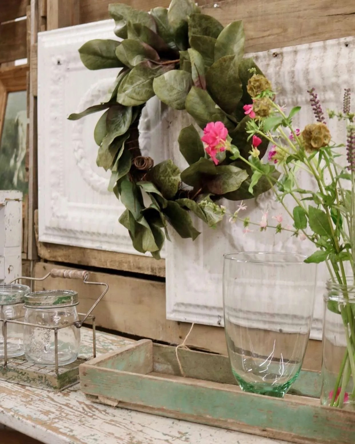 Ceiling tiles add a fun texture behind a wreath.