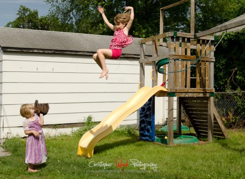 Lily catching Kate jumping from the swing.