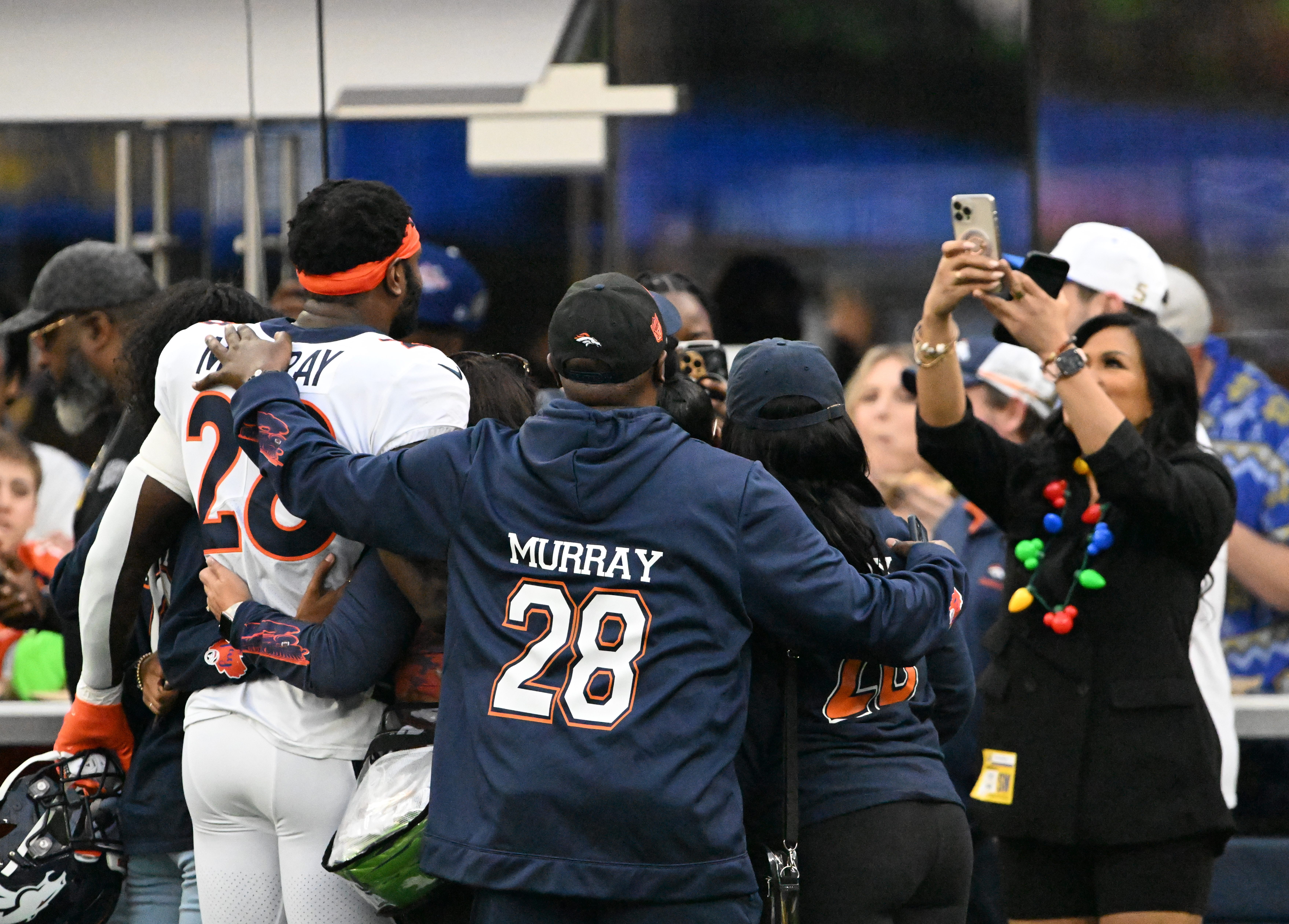 Denver Broncos running back Latavius Murray (28) takes a photo with fans on Dec. 25, 2022, at SoFi Stadium in Inglewood, Calif. (Photo by RJ Sangosti/The Denver Post)
