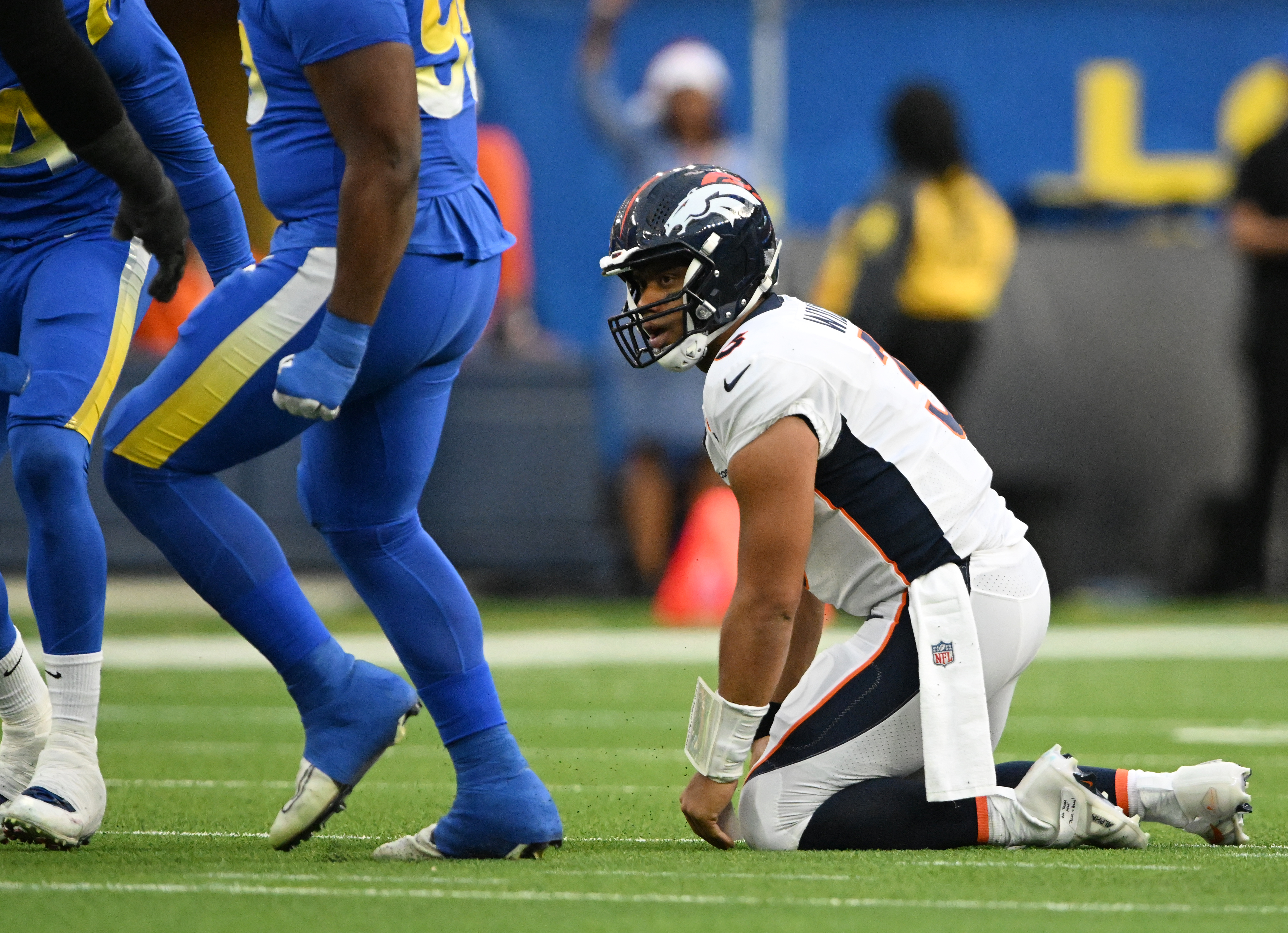 Denver Broncos quarterback Russell Wilson (3) gets up after being sacked at SoFi Stadium on Dec. 25, 2022, in Inglewood, Calif. Denver lost 51 to 14. (Photo by RJ Sangosti/The Denver Post)